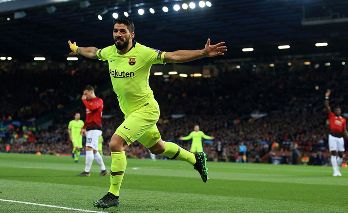 Luis Suarez merayakan gol