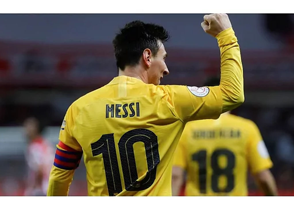 Messi merayakan gol dengan Barcelona