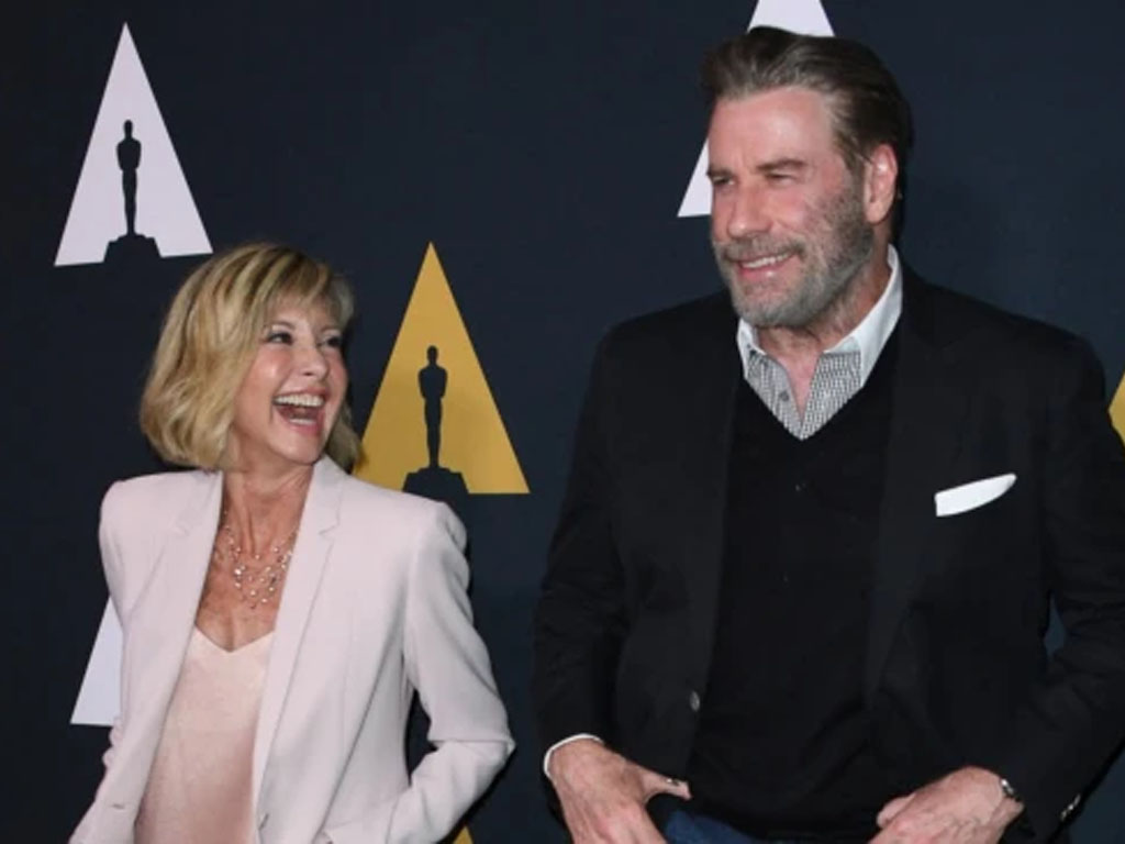 Olivia Newton-John bersama John Travolta