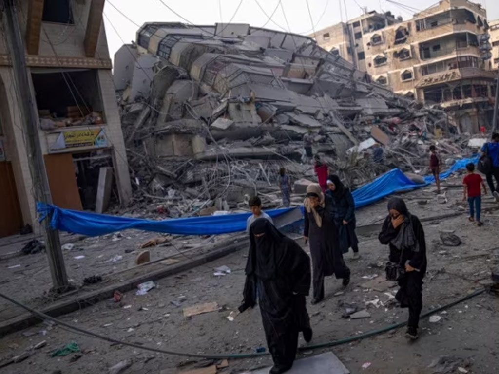 warga palestina dan reruntuhan gedung